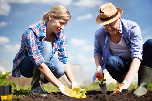 Professional team cutting back weeds and shrubs
